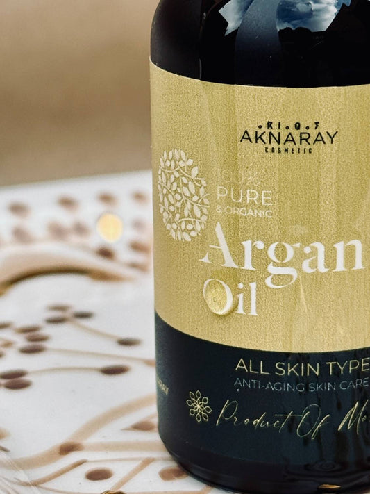 Close-up of Aknaray Argan Oil label showing pure organic Moroccan cold-pressed formula